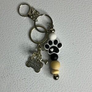 Hand Crafted Black and White Dog Paw Keychain with Bone Charm